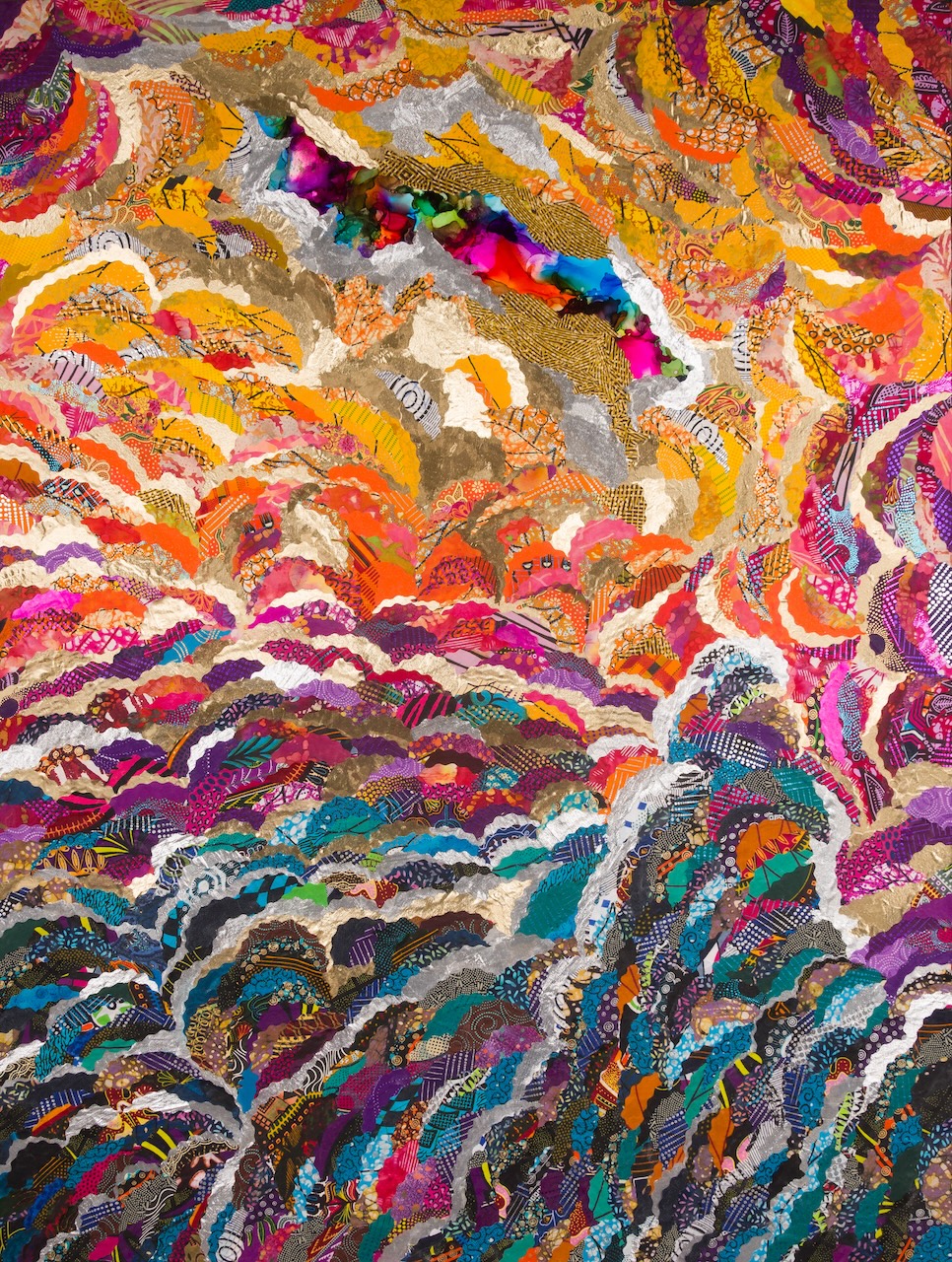 An absract collage of colours that resembles a rippling sky. The fabrics create a blue, to pink, to yellow gradient of billowing coulds that moves towards the top centre of the work where a dark rainbow of colour peaks through a crack in the clouds.