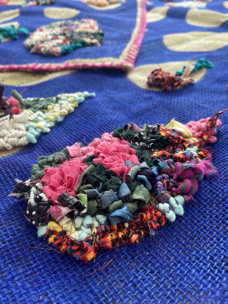Community rug hooking experience