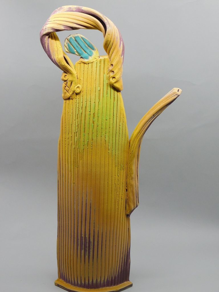 Yellow sculpture teapots