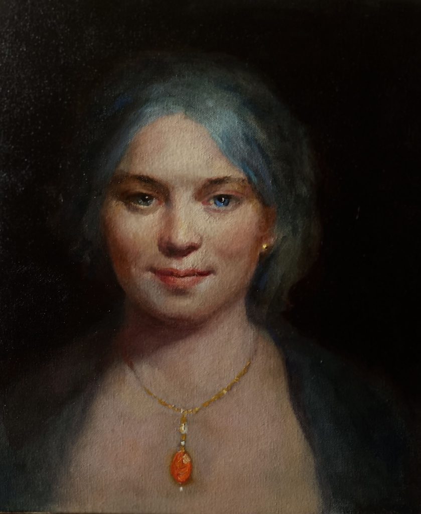 Woman with orange pendant