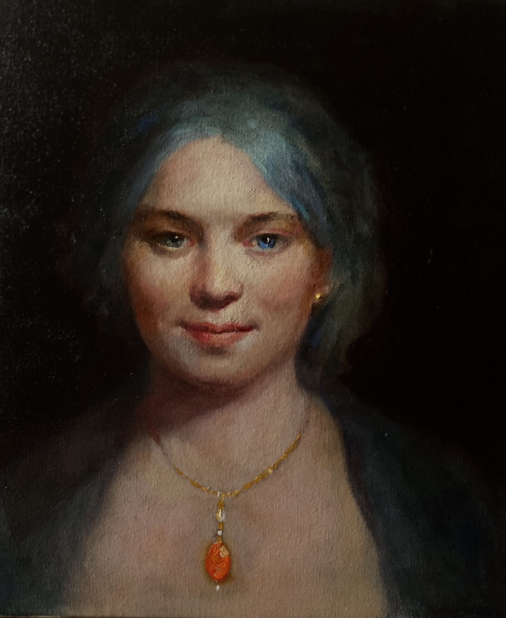 Woman with orange pendant