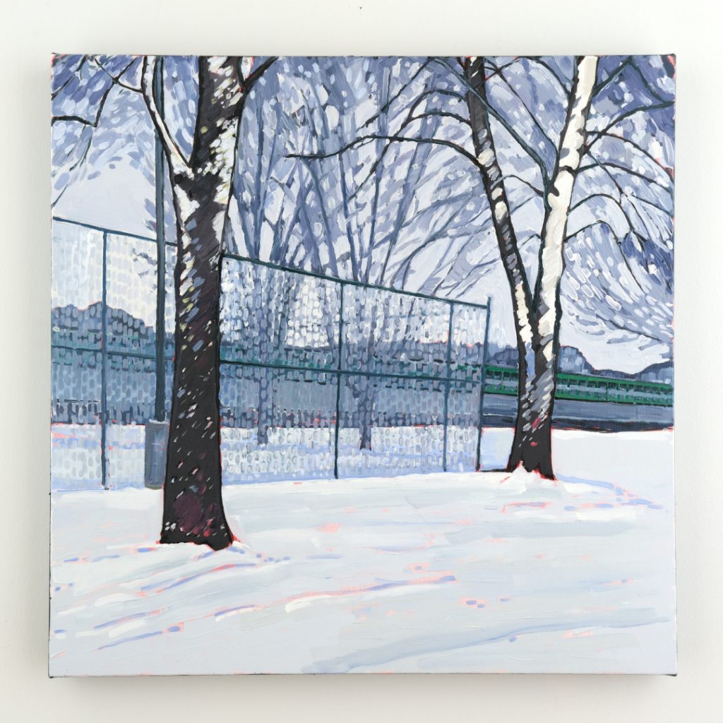 The tennis courts in winter, and a train passing by