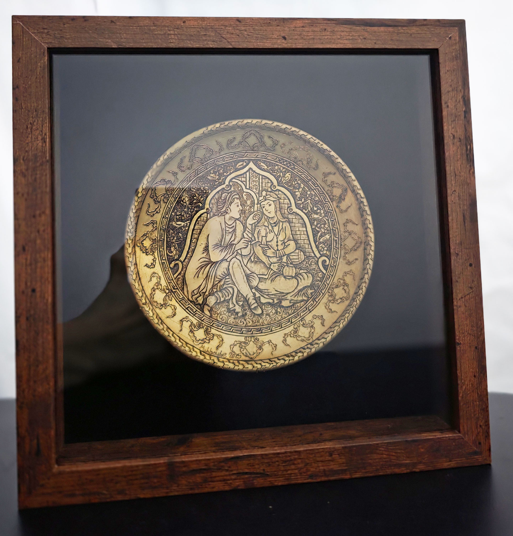 Hand-engraved brass plate depicting a traditional Persian miniature scene of a couple in a romantic banquet setting