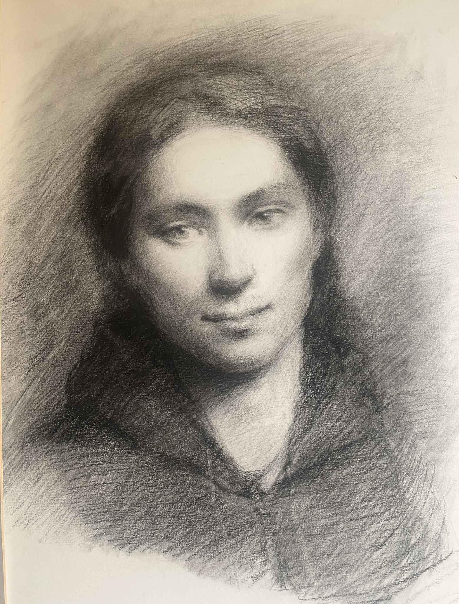 Charcoal drawing soft face dreamy expression angular gentle. Mixture of soft modelling and hatching. 