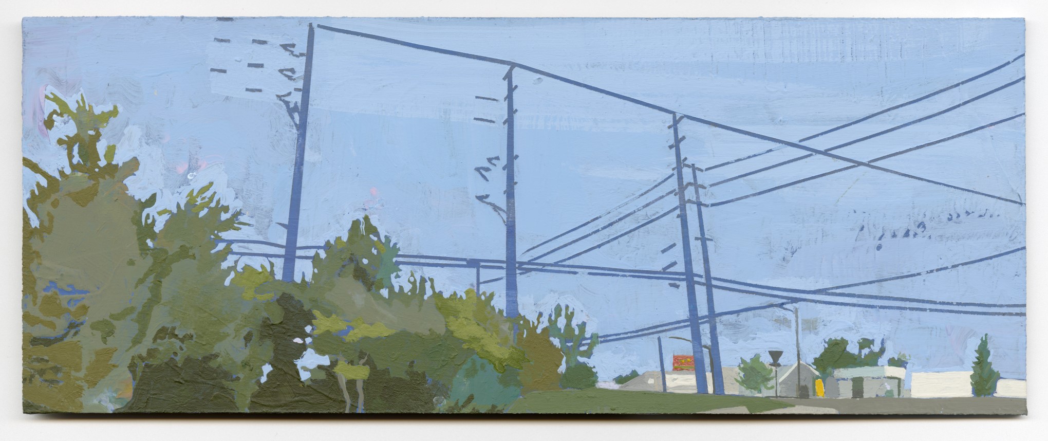 Low angle of tall blue powerlines at an intersection